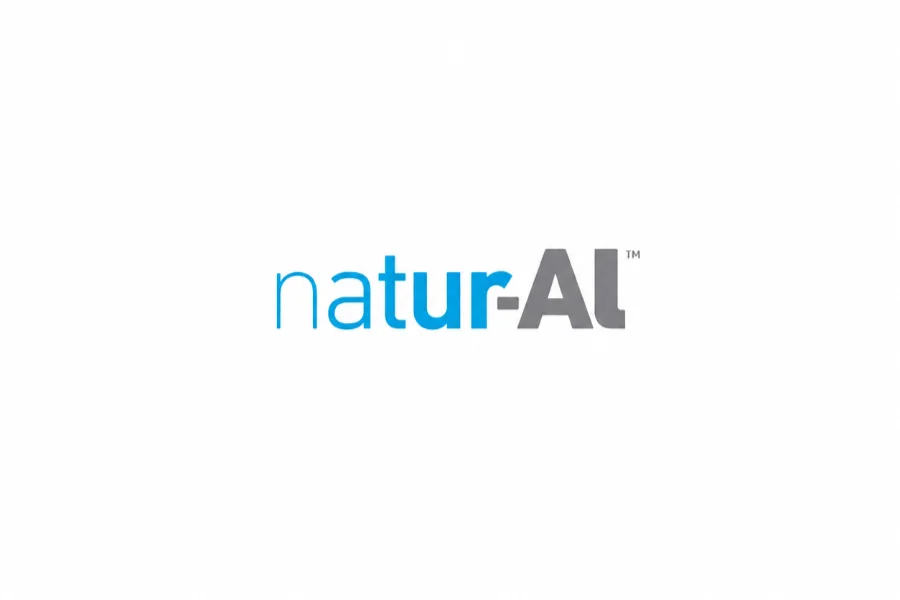 The image shows the word "natur-AL" in a modern font, with "natur" in blue and "AL" in gray, on a white background.